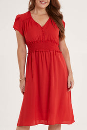 Model Sally wearing size 10 of The Luxe Tulip Sleeve Dress in colour Red (Red), from the front, cropped image