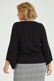 Model Fiona wearing size XL of The Cotton Cashmere Angled Sleeve Knit in colour Black (Black), from the back