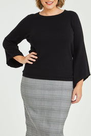 Model Fiona wearing size XL of The Cotton Cashmere Angled Sleeve Knit in colour Black (Black), from the front, cropped image