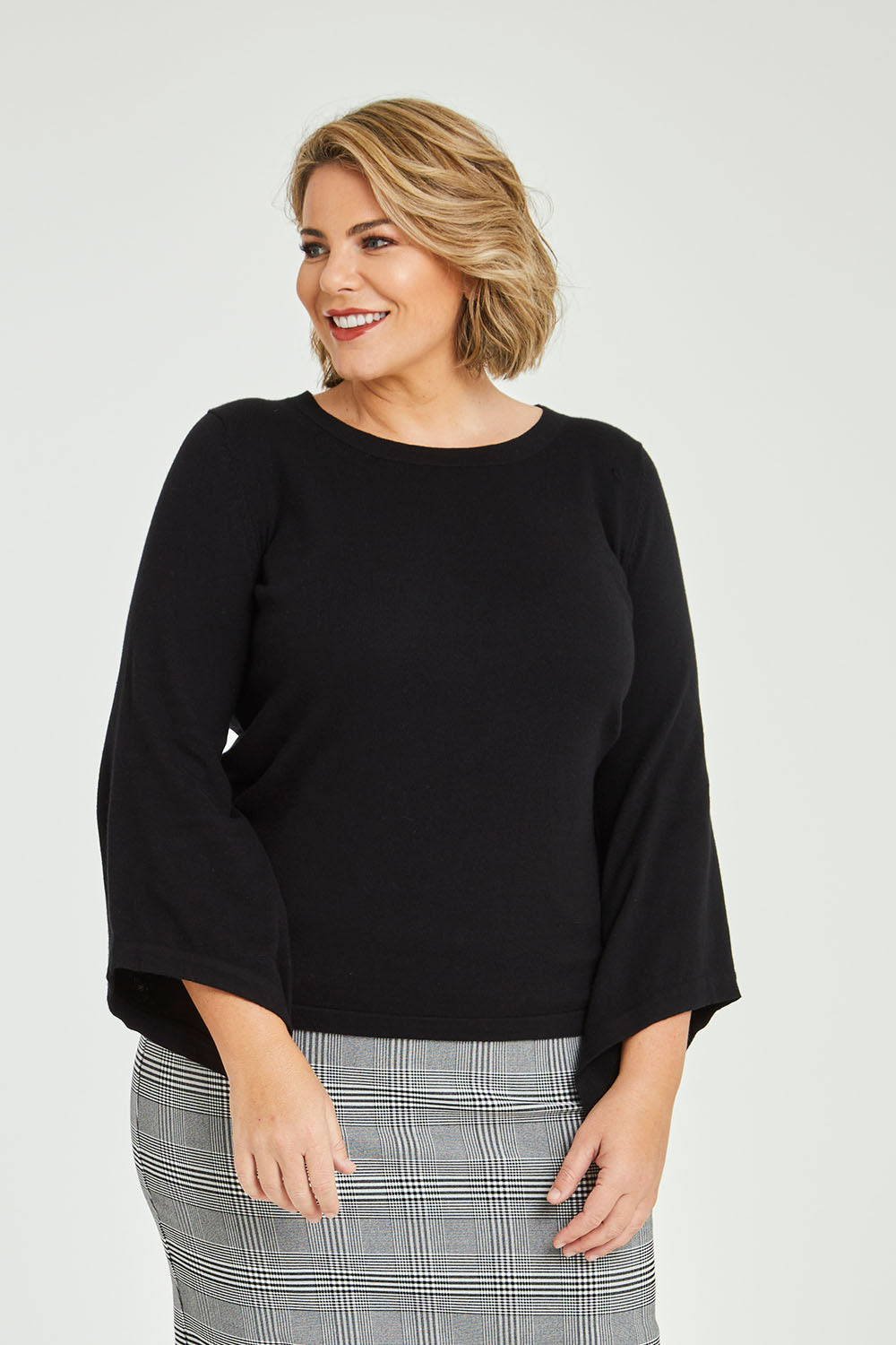 Model Fiona wearing size XXL of The Cotton Cashmere Angled Sleeve Knit in colour Black (Black), from the front, cropped image