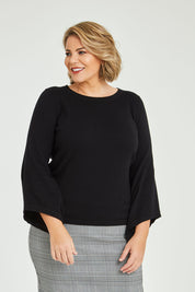 Model Fiona wearing size XXL of The Cotton Cashmere Angled Sleeve Knit in colour Black (Black), from the front, cropped image