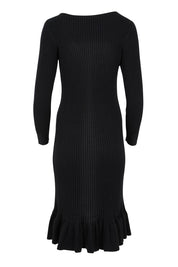 Product shot of The Ruffle Hem Knitted Rib Dress in colour Black (Black), from the back