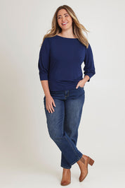 Model Chanel wearing size 16 of The Bamboo Boat Neck Top in colour Navy (Blue), from the front, showing the whole outfit