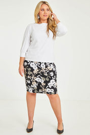 Model Katie wearing size 16 of The Bamboo Boat Neck Top in colour Snow (White), from the front, showing the whole outfit