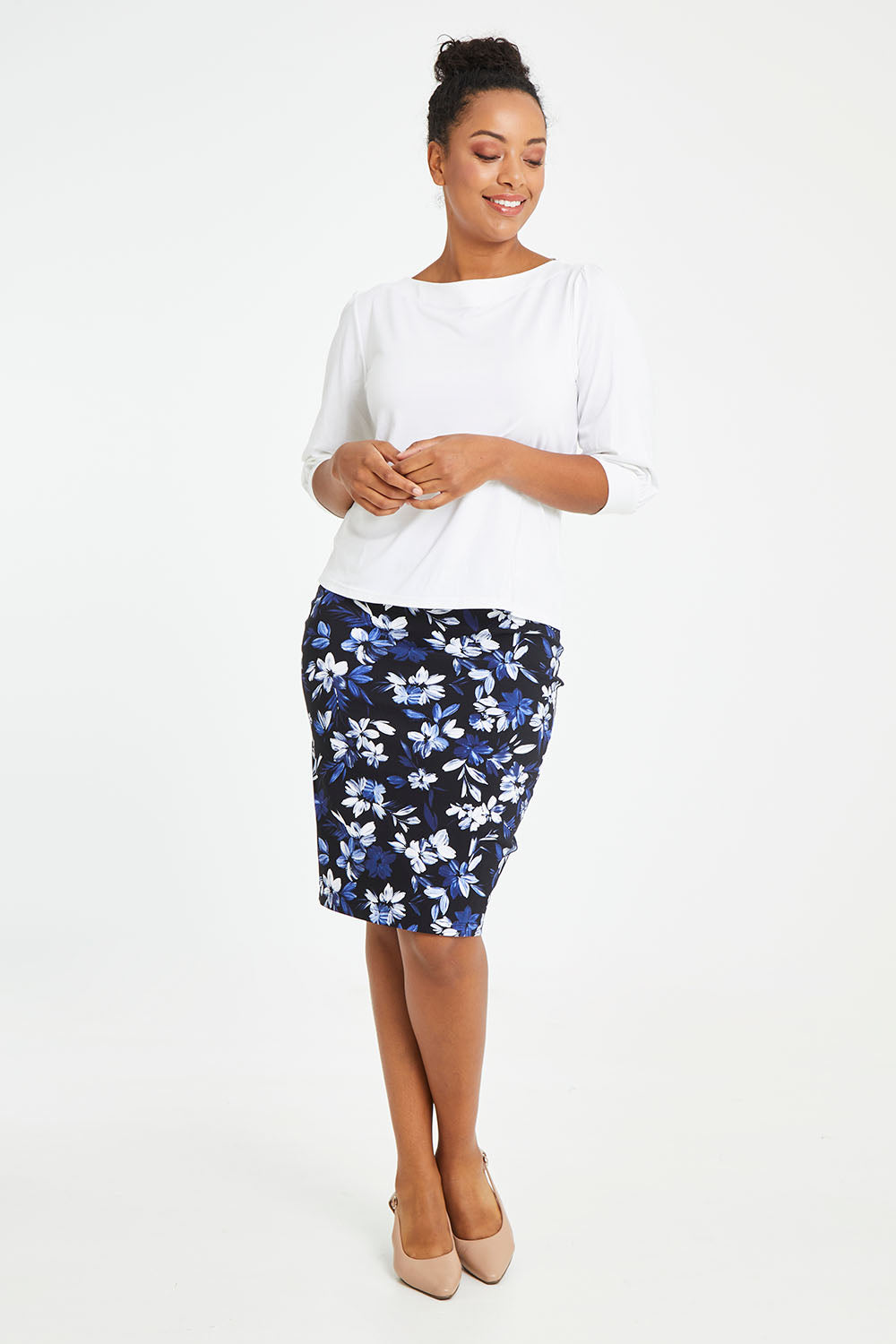 Model Noli wearing size 14 of The Bamboo Boat Neck Top in colour Snow (White), from the front, showing the whole outfit