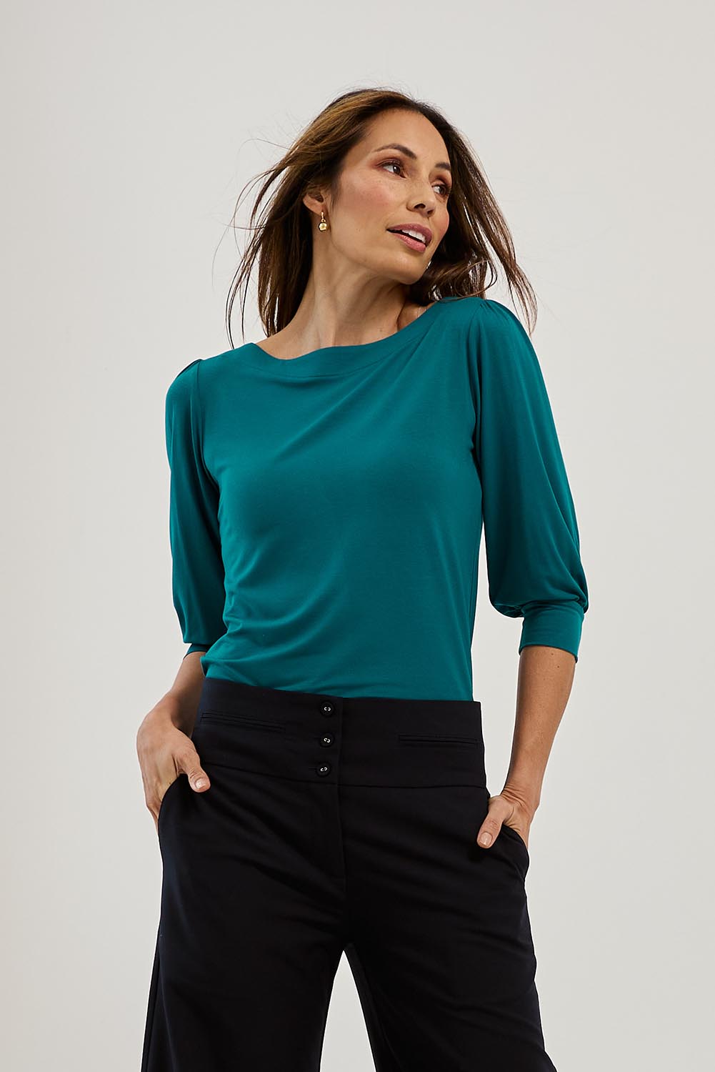 Model Amanda wearing size 10 of The Bamboo Boat Neck Top in colour Tealgreen (Green), from the front, showing the whole outfit
