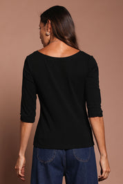 Model Amanda wearing size 10 of The Reversible Cotton Stretch Top in colour Black (Black), from the back