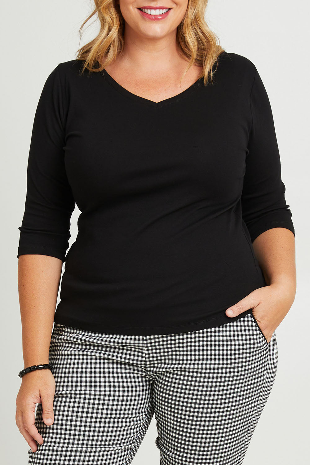 Model Fiona wearing size 16 of The Reversible Cotton Jersey Top in colour Black (Black), from the front, cropped image