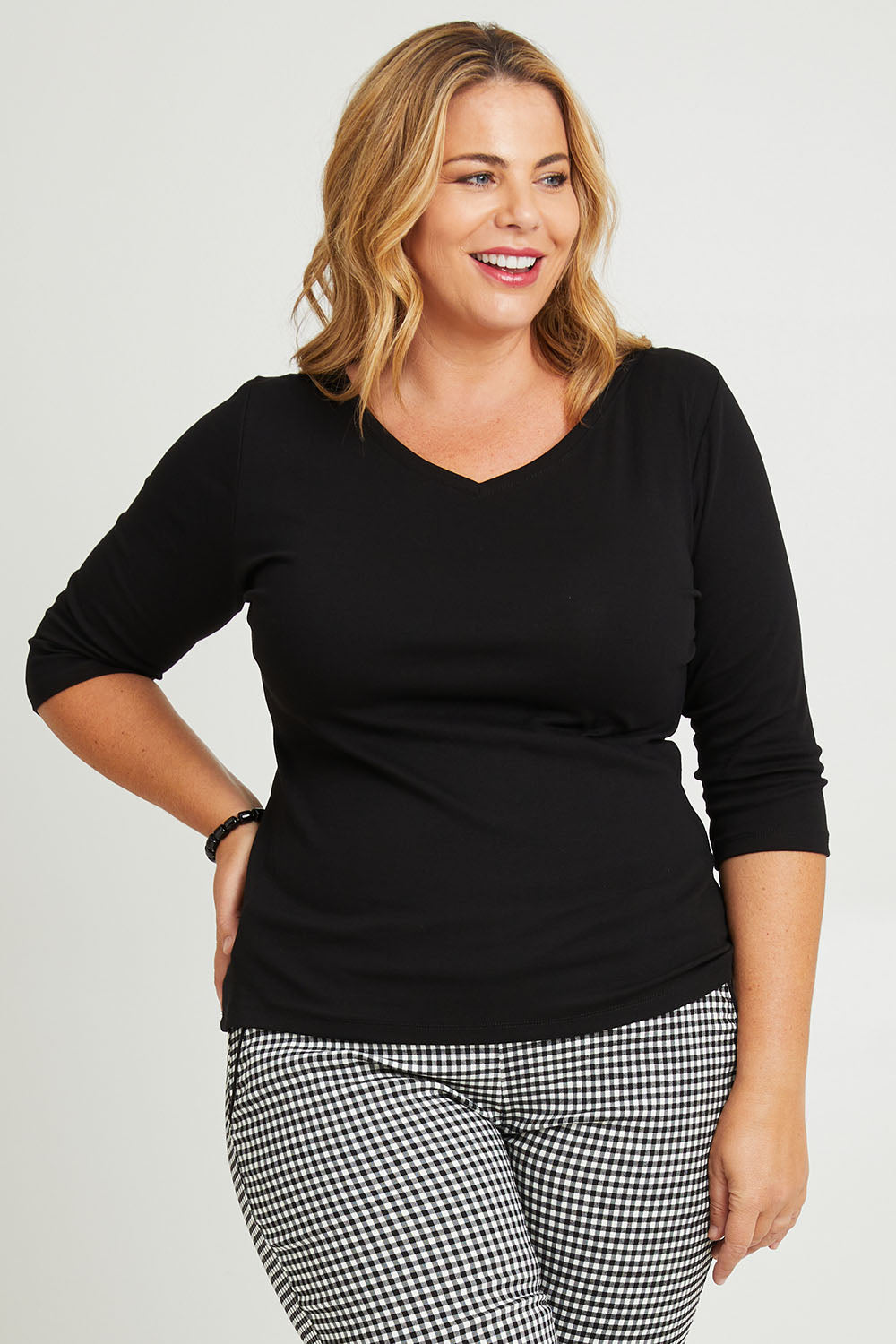 Model Fiona wearing size 16 of The Reversible Cotton Jersey Top in colour Black (Black), from the front, cropped image
