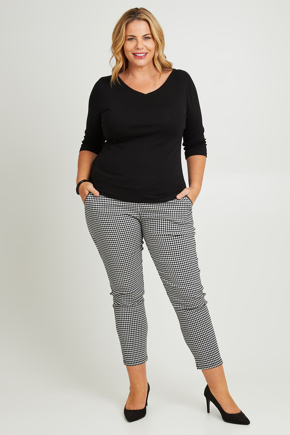 Model Fiona wearing size 16 of The Reversible Cotton Jersey Top in colour Black (Black), from the front, showing the whole outfit