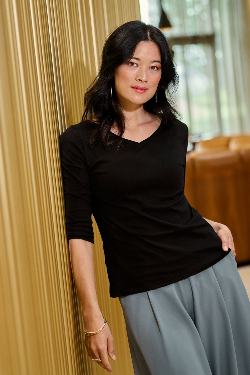 Model Miranda wearing size 10 of The Reversible Cotton Jersey Top in colour Black (Black), from the front, showing the whole outfit