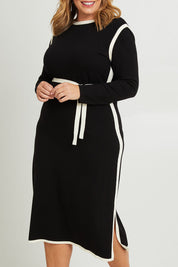 Model Fiona wearing size XL of The Reversible Contrast Detail Knit Dress in colour Black (Black), from the front, cropped image