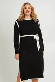 Model Fiona wearing size XL of The Reversible Contrast Detail Knit Dress in colour Black (Black), from the front, cropped image