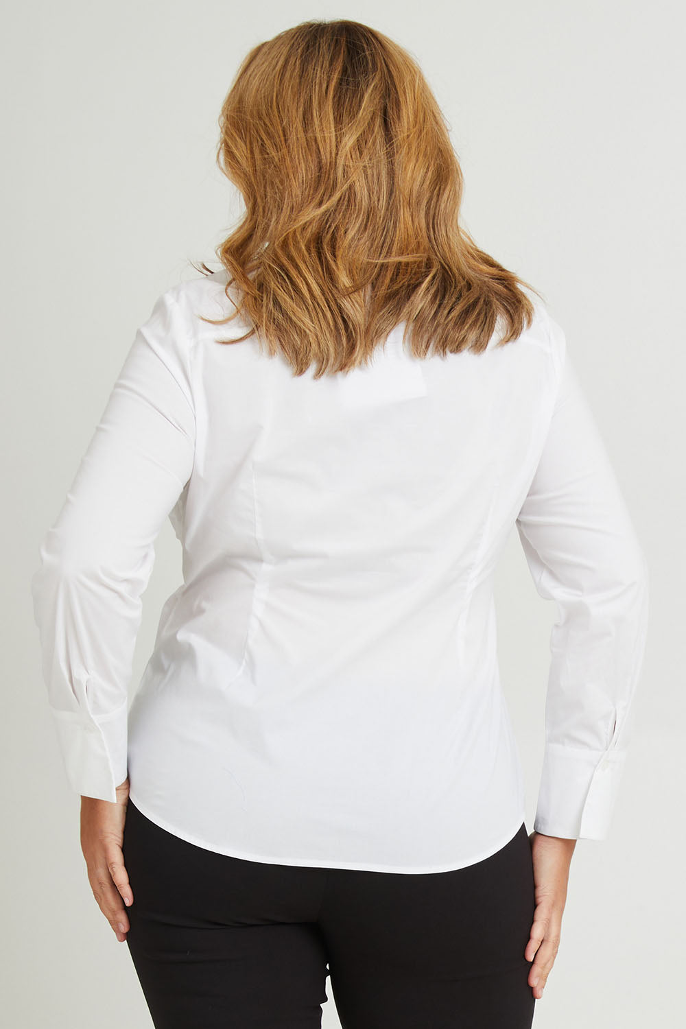 Model Fiona wearing size 16 of The Classic Cotton Stretch Shirt in colour White (White), from the back