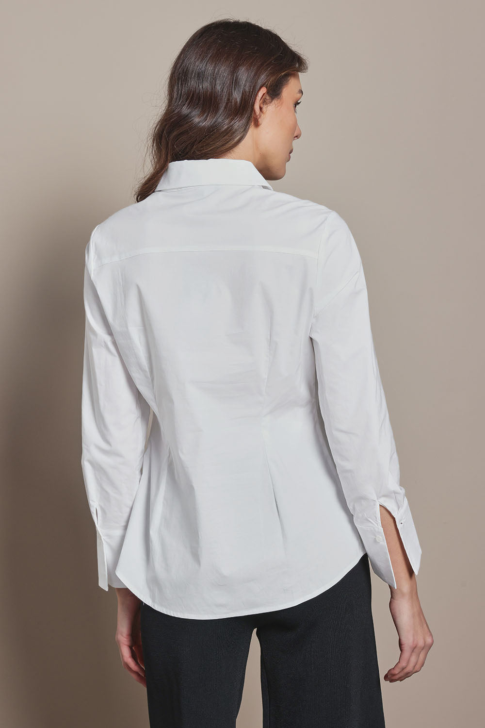 Model Madeline wearing size 10 of The Classic Cotton Stretch Shirt in colour White (White), from the back