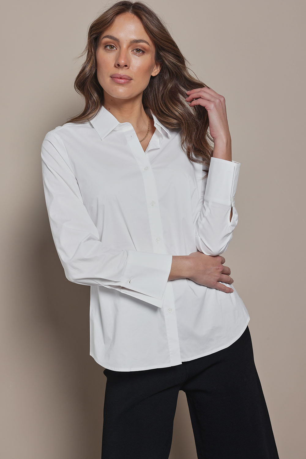 Model Madeline wearing size 10 of The Classic Cotton Stretch Shirt in colour White (White), from the front, cropped image
