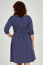 Model Maddy wearing size 16 of The 3/4 Sleeve Cotton Stretch Dress in colour Spots (Blue), from the back