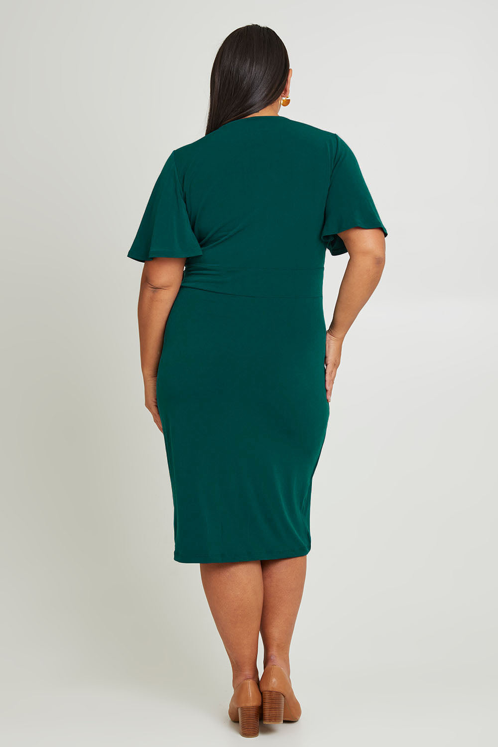 Model Ashleigh wearing size 16 of The Mock Wrap Dress in colour Pine (Green), from the back