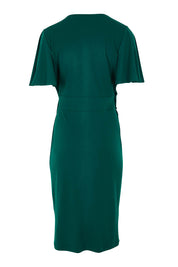 Product shot of The Mock Wrap Dress in colour Pine (Green), from the back