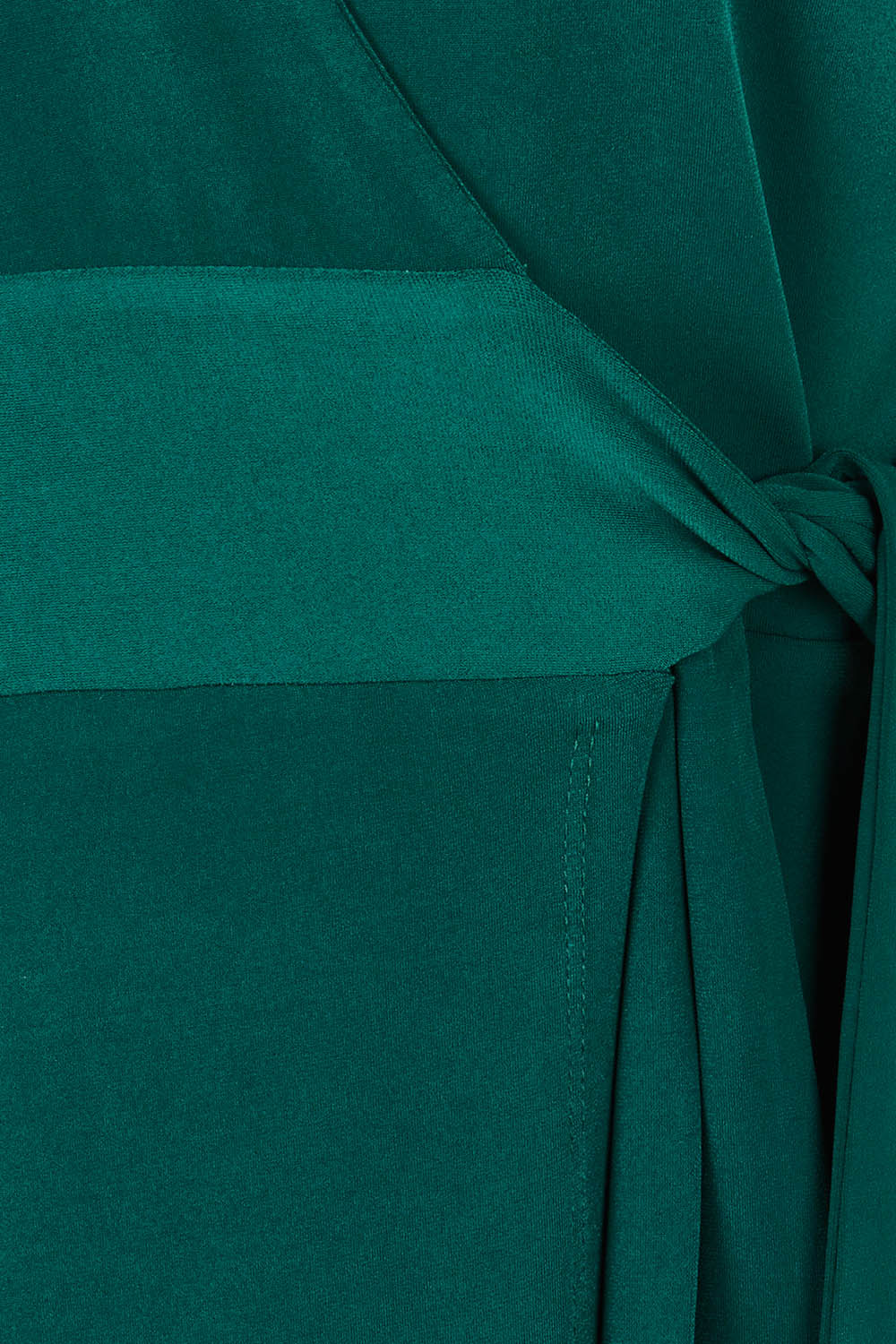 Product shot of The Mock Wrap Dress in colour Pine (Green), detail