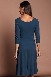 Model Amanda wearing size S of The 3/4 Sleeve Reversible Knit Dress in colour Darkpetrol (Blue), from the back