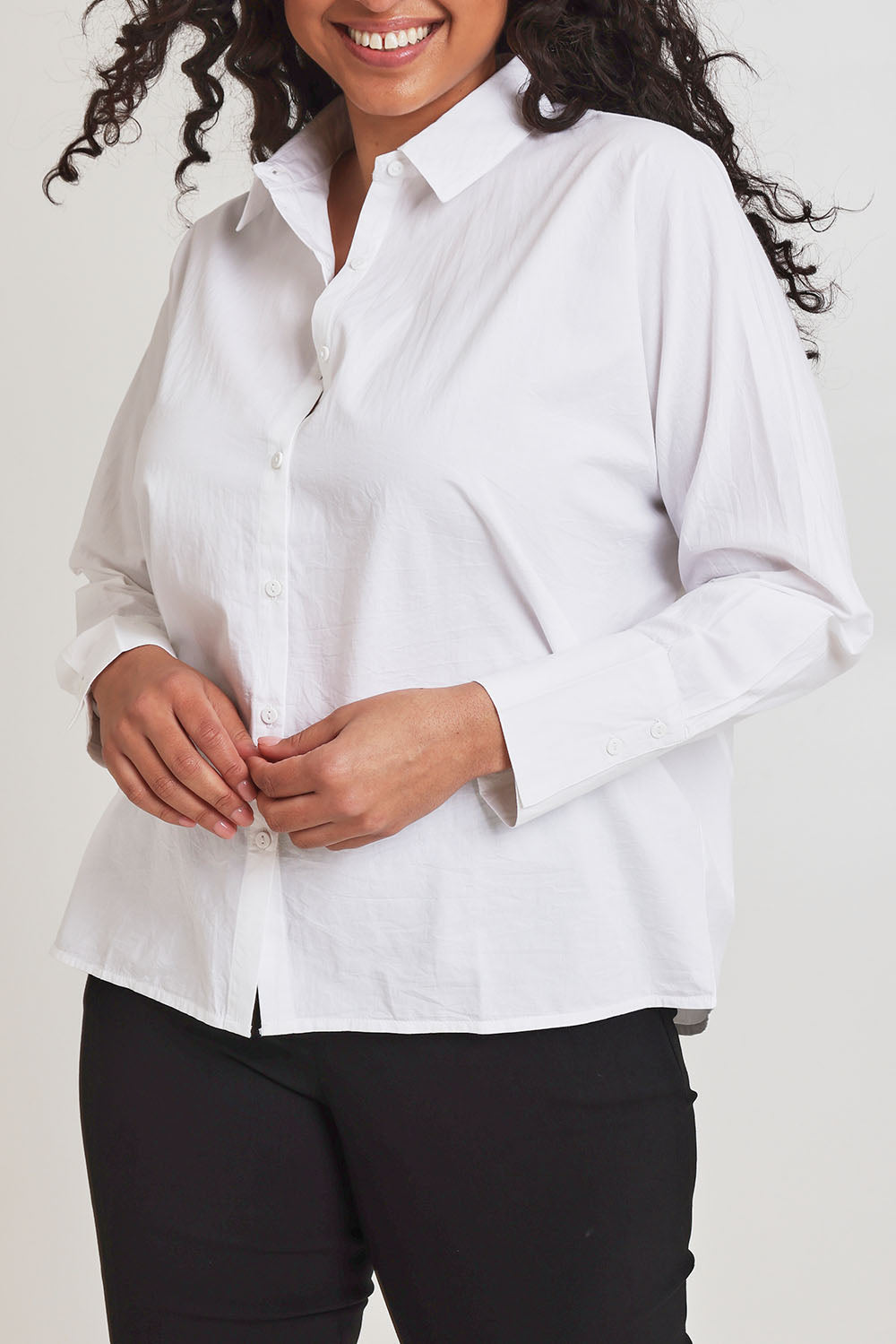 Model Terri-Leigh wearing size 14 of The Dolman Sleeve Cotton Shirt in colour Snow (White), from the front, cropped image