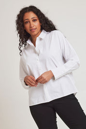 Model Terri-Leigh wearing size 14 of The Dolman Sleeve Cotton Shirt in colour Snow (White), from the front, cropped image