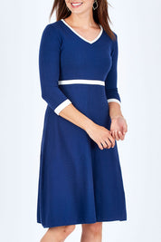 Model Rebecca wearing size S of The Fit And Flare Knit Dress in colour NavyIvory (Blue), from the front, cropped image