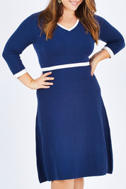 Model Sophie wearing size L of The Fit And Flare Knit Dress in colour NavyIvory (Blue), from the front, cropped image