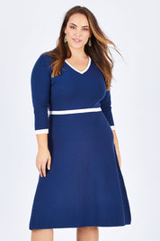 Model Sophie wearing size L of The Fit And Flare Knit Dress in colour NavyIvory (Blue), from the front, cropped image
