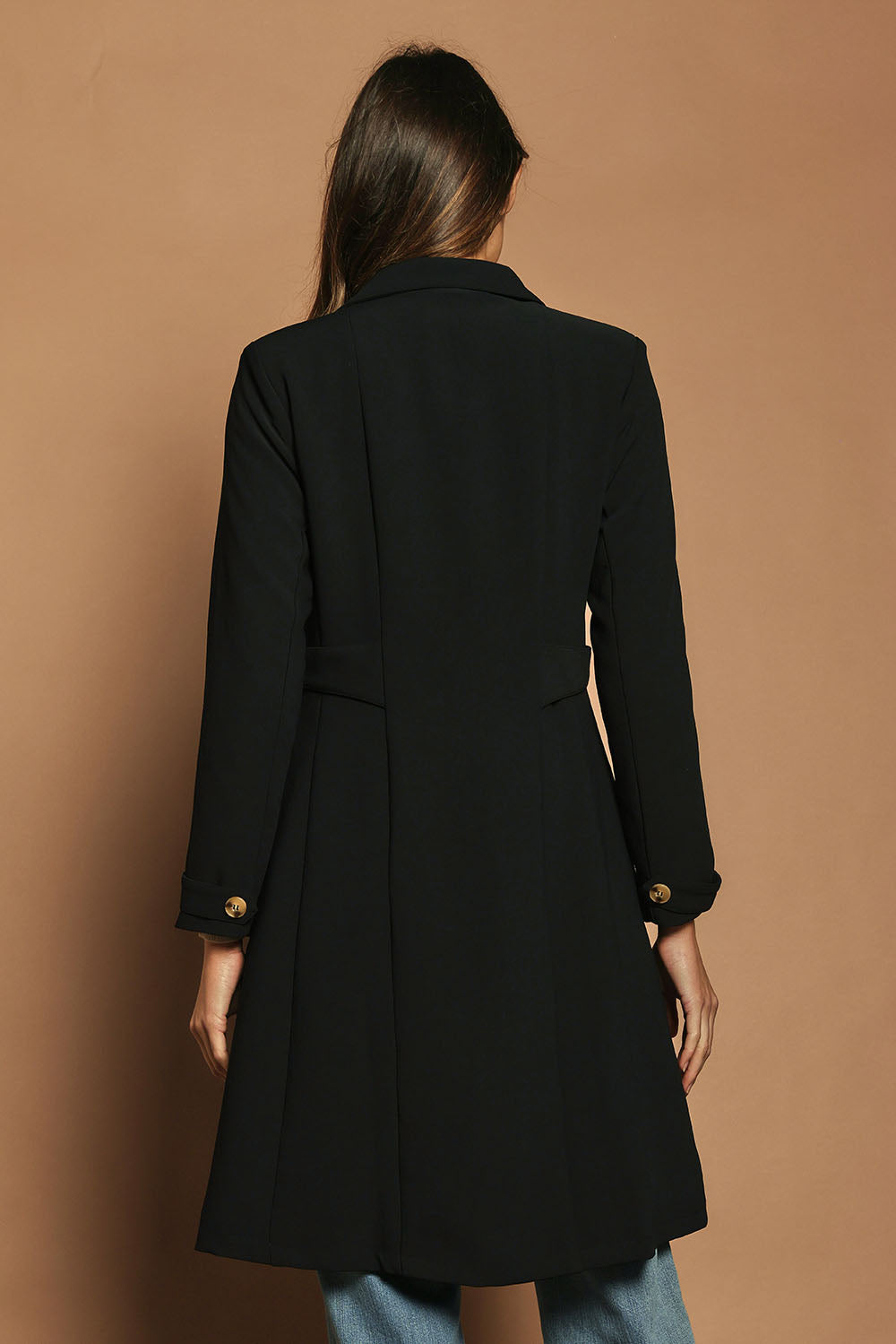 Model Madeline wearing size 10 of The Tab Detail Tailored Longline Coat in colour Black (Black), from the back