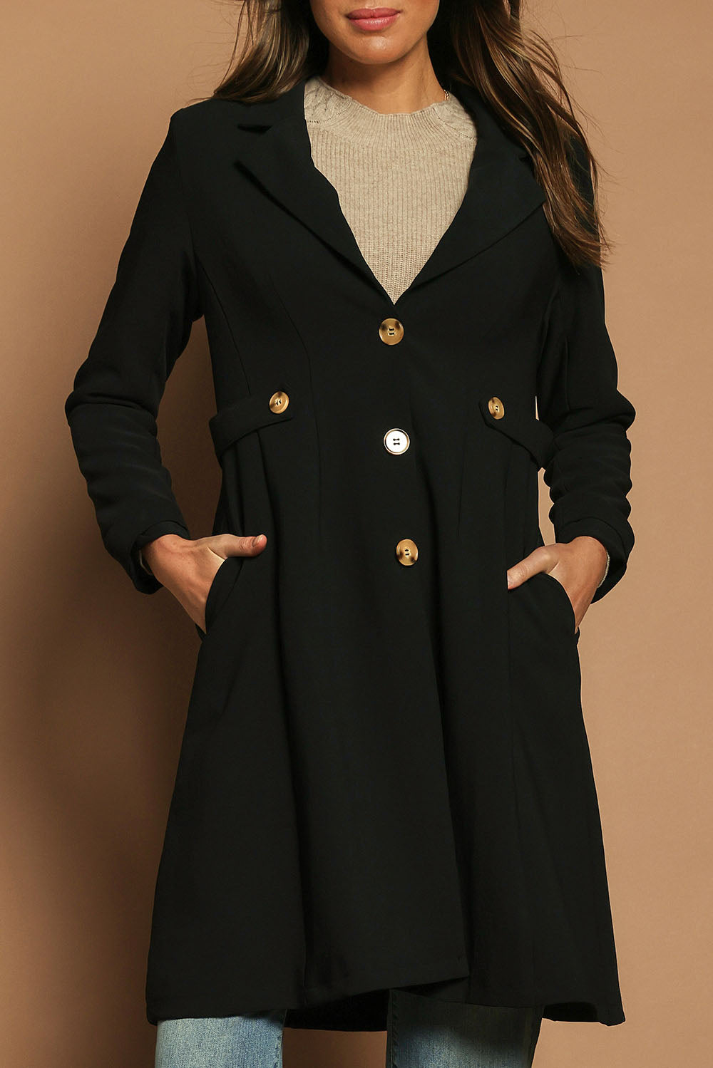 Model Madeline wearing size 10 of The Tab Detail Tailored Longline Coat in colour Black (Black), from the front, cropped image