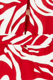 Product shot of The Bubble Sleeve Button Through Dress in colour Abstract (Red), detail
