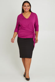 Model Ashleigh wearing size 16 of The Bamboo Tie Waist Top in colour Berry (Pink), from the front, showing the whole outfit