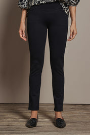 Model Amanda wearing size 10 of The High Rise Pull On Ponte Pant in colour Black (Black), from the front, cropped image