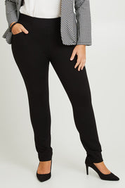Model Fiona wearing size 16 of The High Rise Pull On Ponte Pant in colour Black (Black), from the front, cropped image