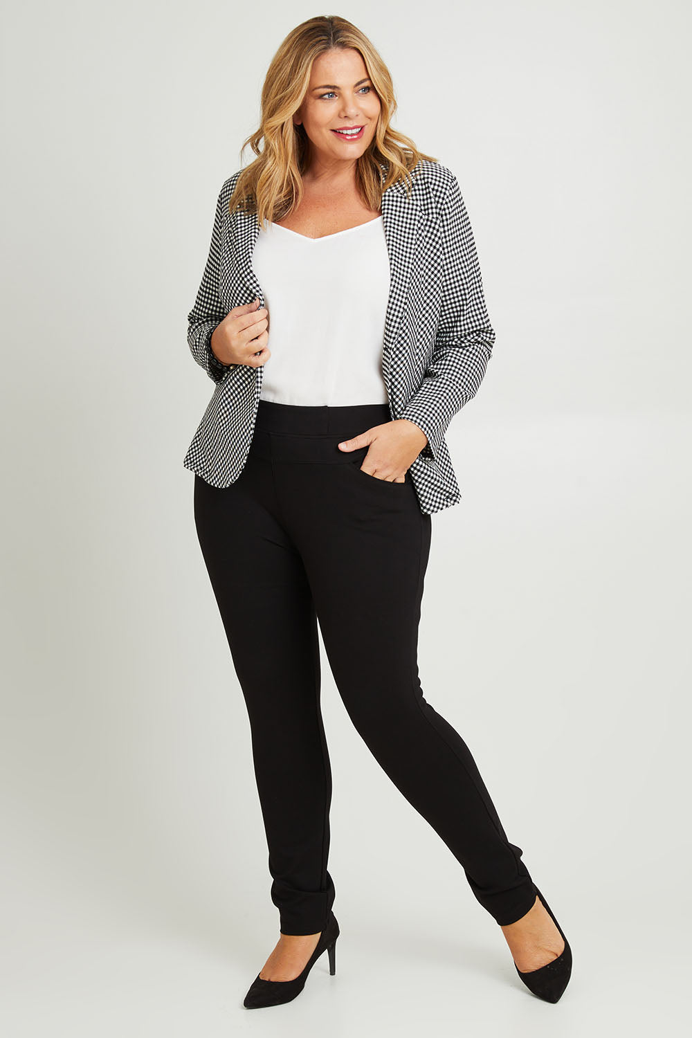 Model Fiona wearing size 16 of The High Rise Pull On Ponte Pant in colour Black (Black), from the front, showing the whole outfit