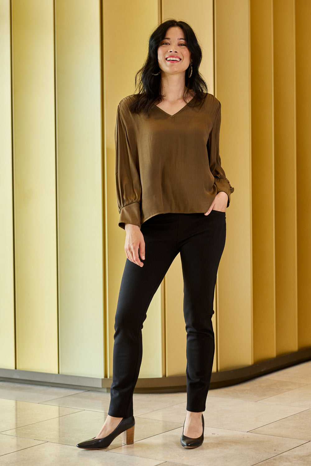 Model Miranda wearing size 10 of The High Rise Pull On Ponte Pant in colour Black (Black), from the front, showing the whole outfit