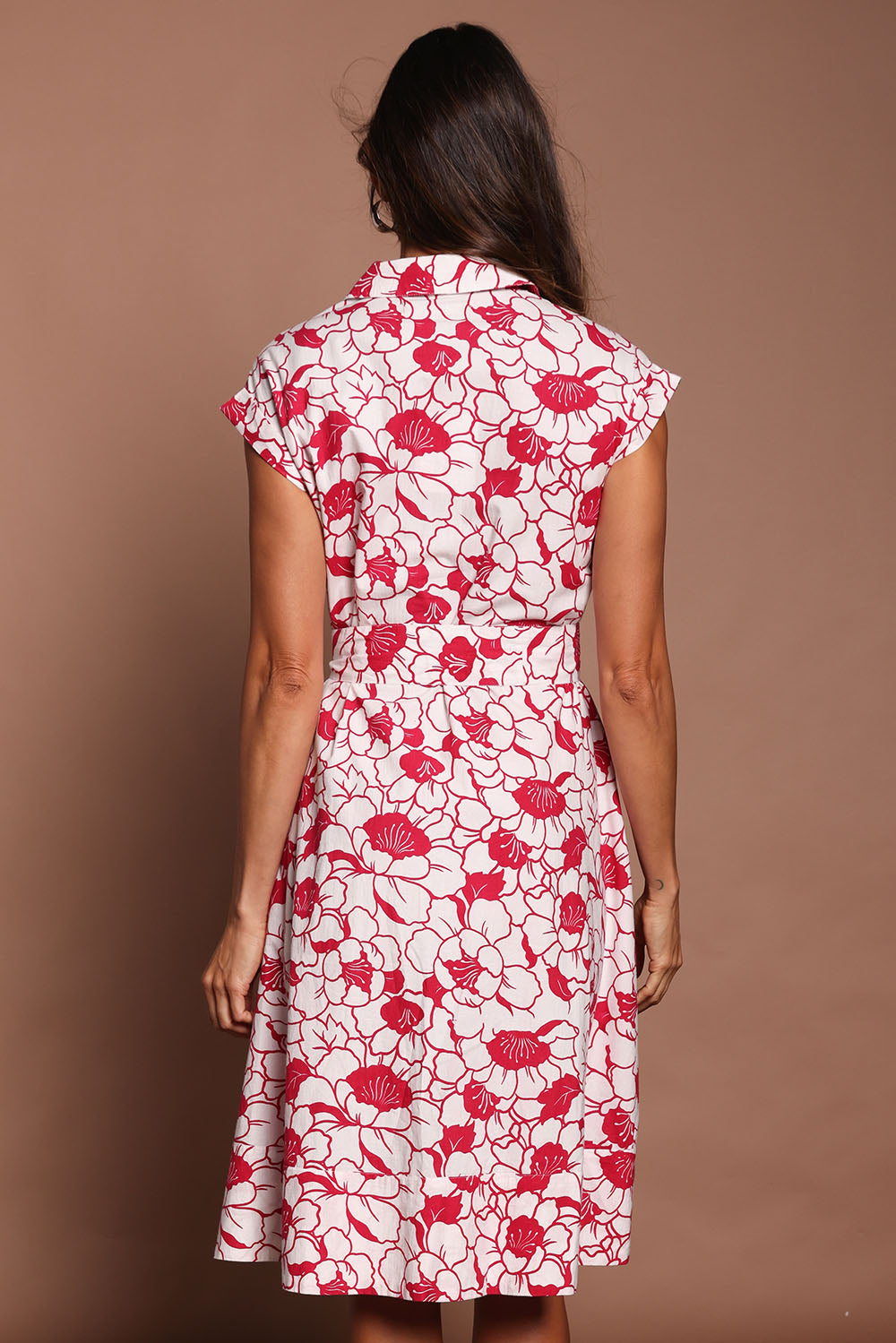 Model Amanda wearing size 10 of The Printed Cotton Shirt Dress in colour Peony (Pink), from the back