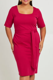 Model Ashleigh wearing size 16 of The Square Neck Ponte Dress in colour Raspberry (Pink), from the front, cropped image