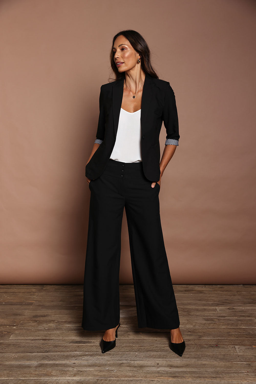 Model Amanda wearing size 10 of The Tailored Pant in colour Black (Black), from the front, showing the whole outfit