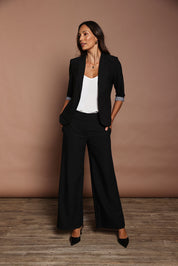 Model Amanda wearing size 10 of The Tailored Pant in colour Black (Black), from the front, showing the whole outfit
