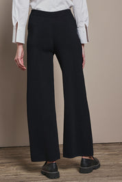 Model Madeline wearing size S of The Milano Knit Pull On Pant in colour Black (Black), from the back