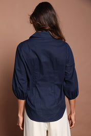 Model Amanda wearing size 10 of The Cotton Blouson Sleeve Shirt in colour Navy (Blue), from the back