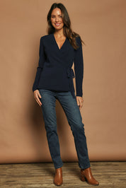 Model Madeline wearing size S of The Milano Knit Wrap Top in colour Darknavy (Blue), from the front, showing the whole outfit