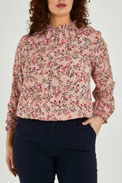 Model Maddy wearing size 16 of The Shirring Detail Printed Blouse in colour Blossom (Pink), from the front, cropped image