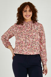 Model Maddy wearing size 16 of The Shirring Detail Printed Blouse in colour Blossom (Pink), from the front, cropped image