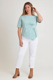 Model Chanel wearing size 16 of The Cotton Stretch Waist Detail Top in colour Duckegg (Blue), from the front, showing the whole outfit