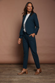 Model Amanda wearing size 10 of The Pintuck Detail Tailored Pant in colour Deepocean (Blue), from the front, showing the whole outfit