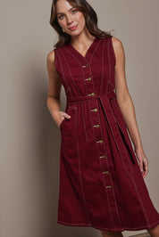 Model Madeline wearing size 10 of The Cotton Twill Contrast Stitching Dress in colour Burgundy (Red), from the front, cropped image
